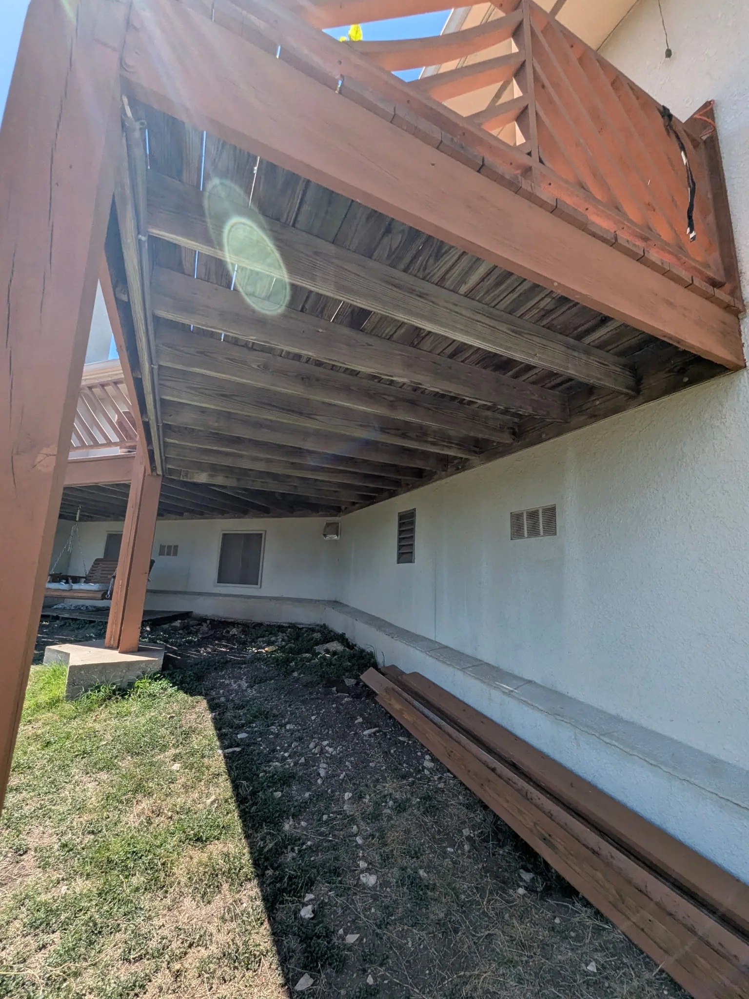 Underside of original deck framing before joist hanger upgrades
