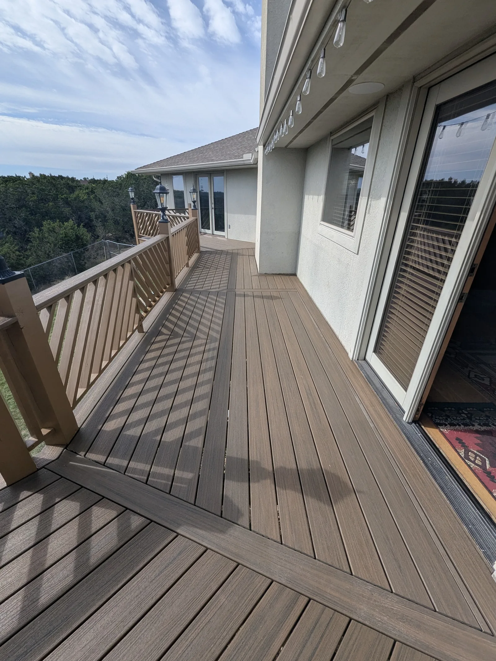 Finished deck walkway with Trex decking and rail lights