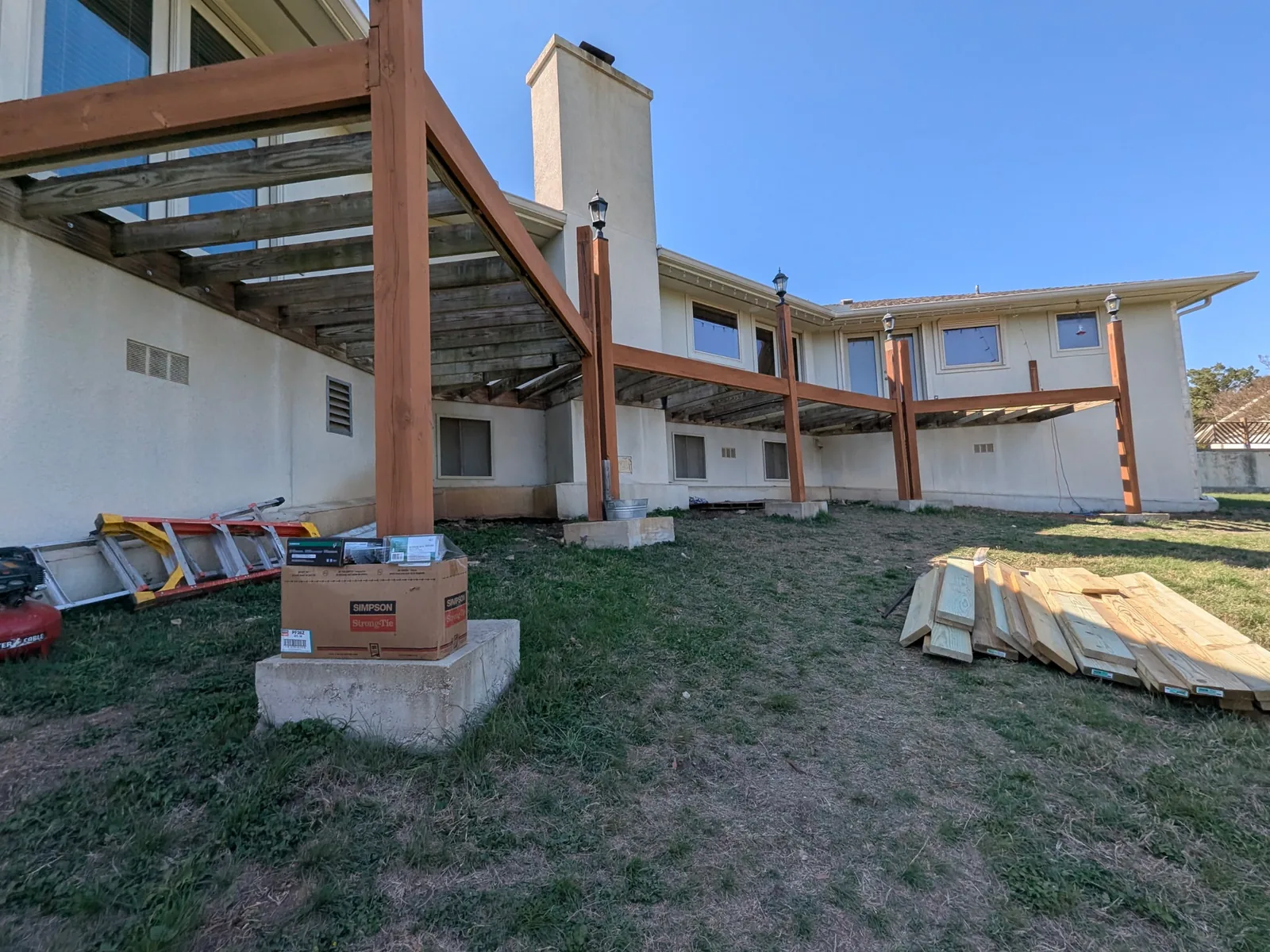 Deck with handrail rebuild in progress after resurfacing