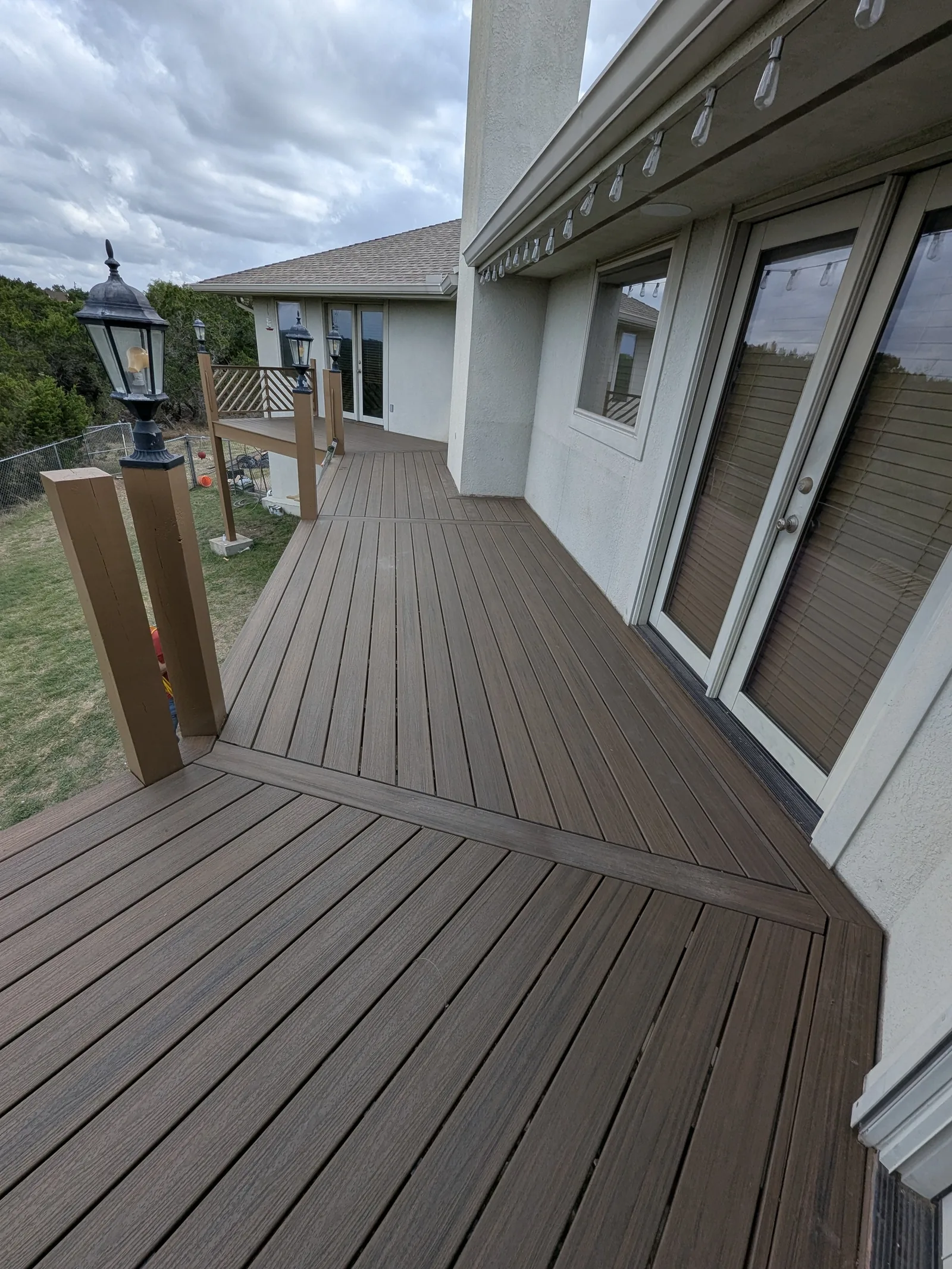 New Trex deck surface before final handrail rebuild was complete