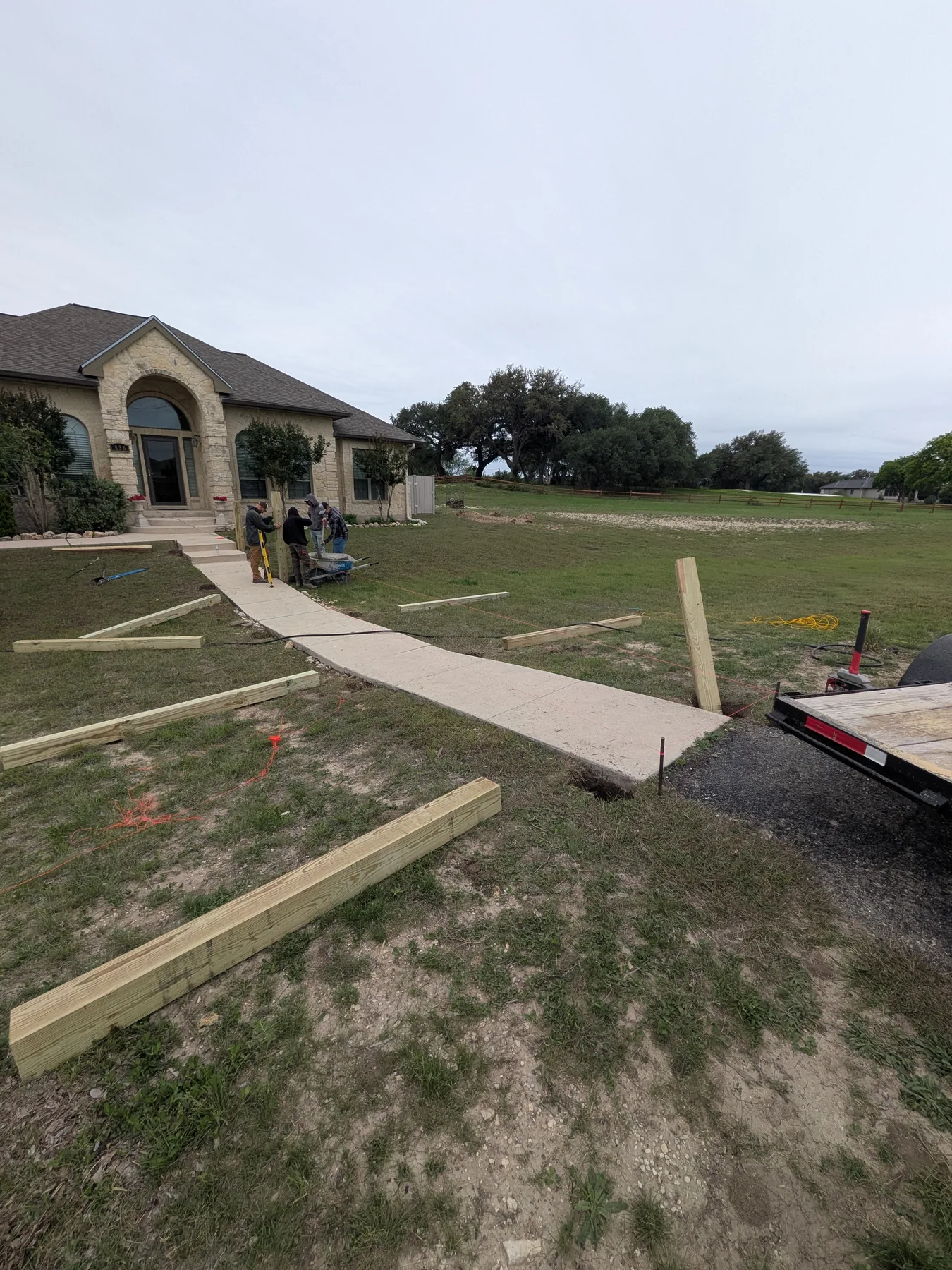 Crew setting post locations for the raised boardwalk bridge