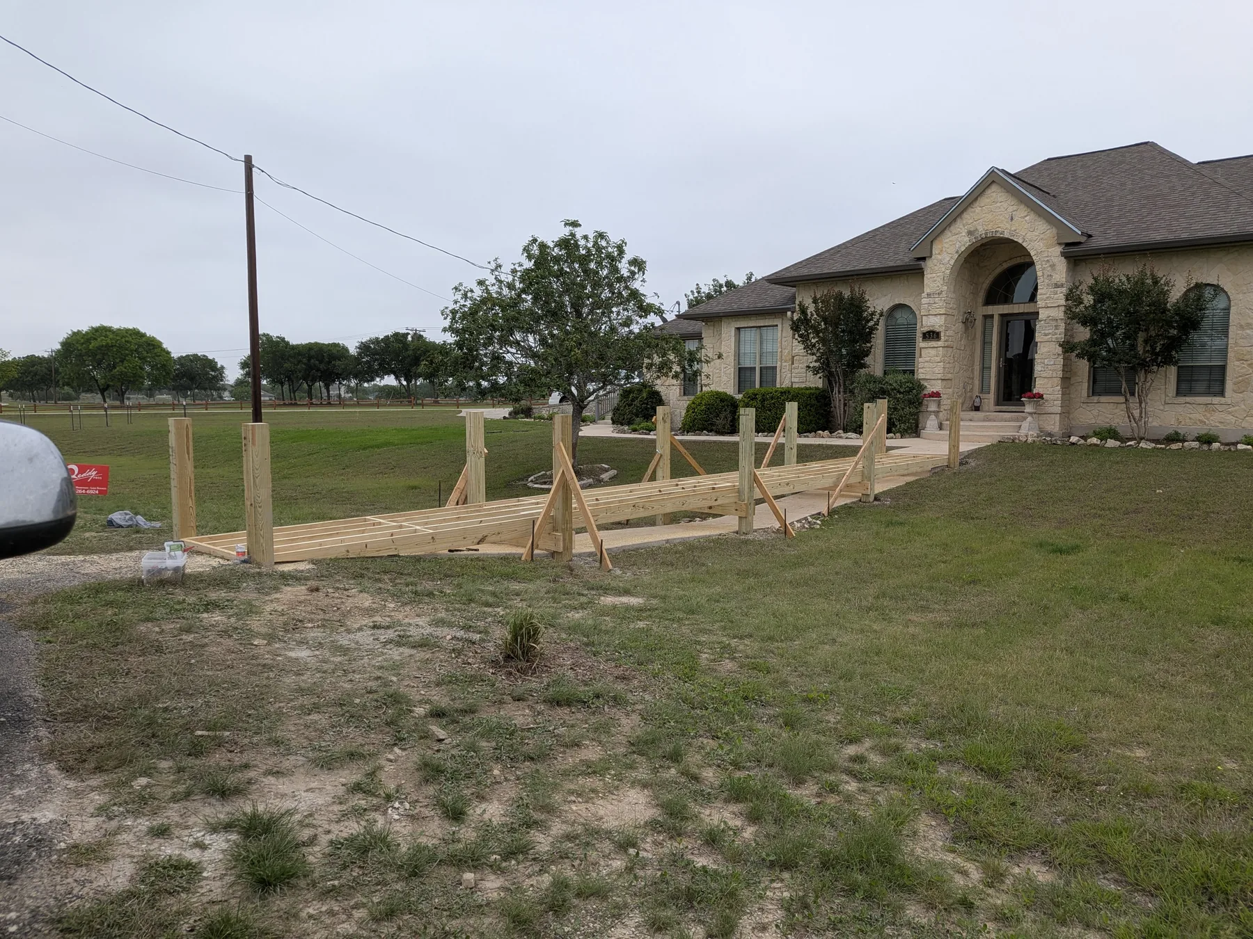 Boardwalk framing underway between parking area and front entry