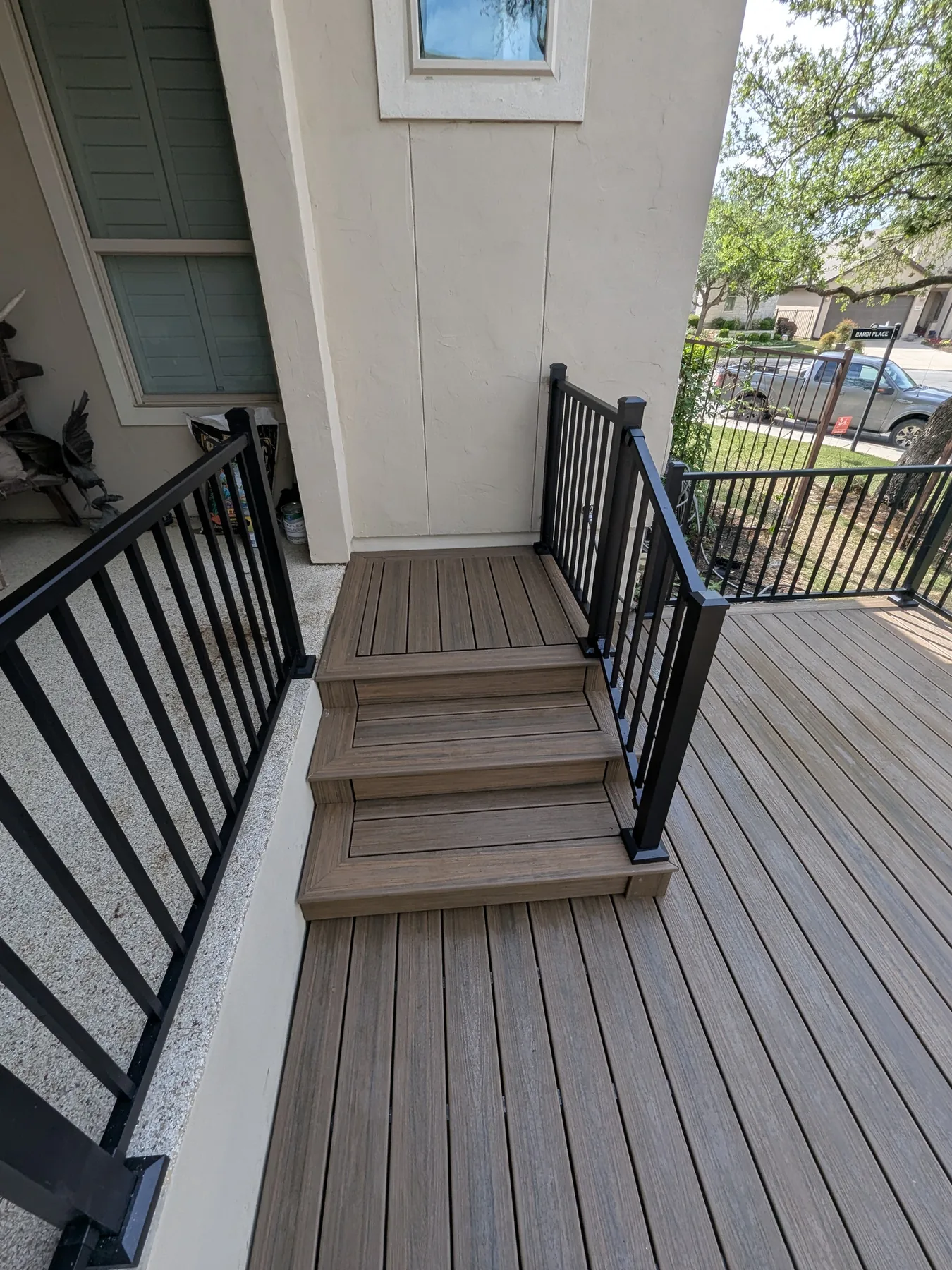 Finished back stairs rebuilt with Trex and black metal railing