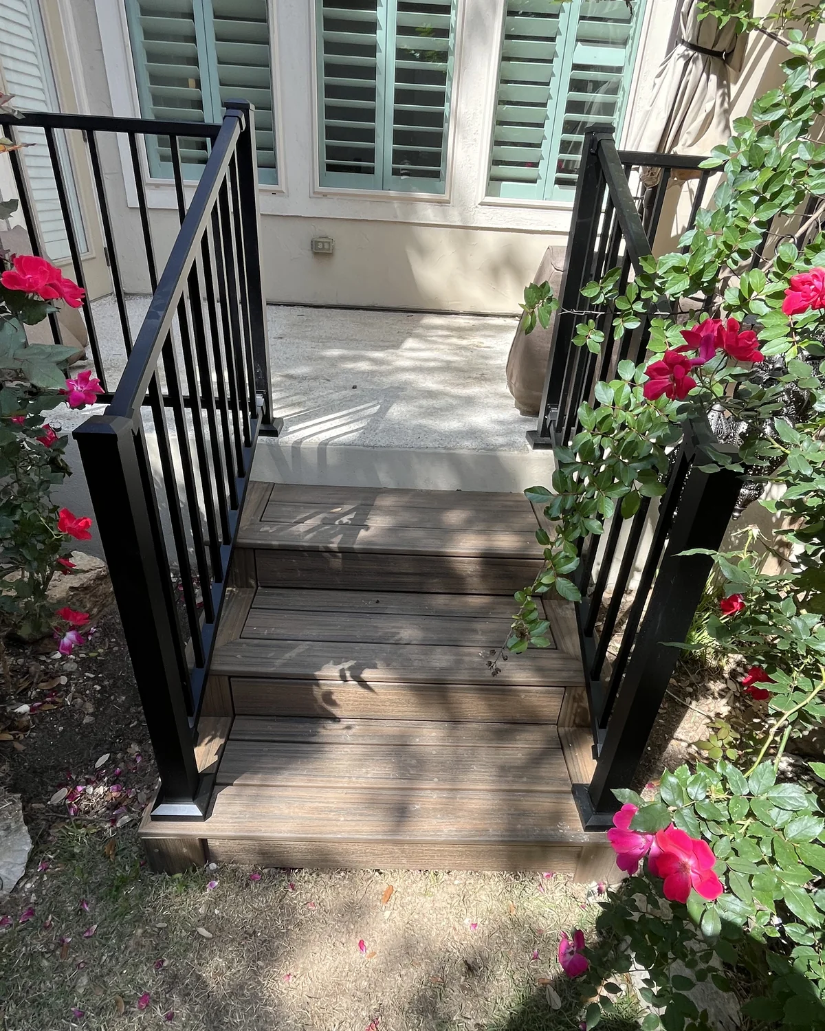 Back stairs after the Carter Scenic Oaks Trex rebuild with black metal railings