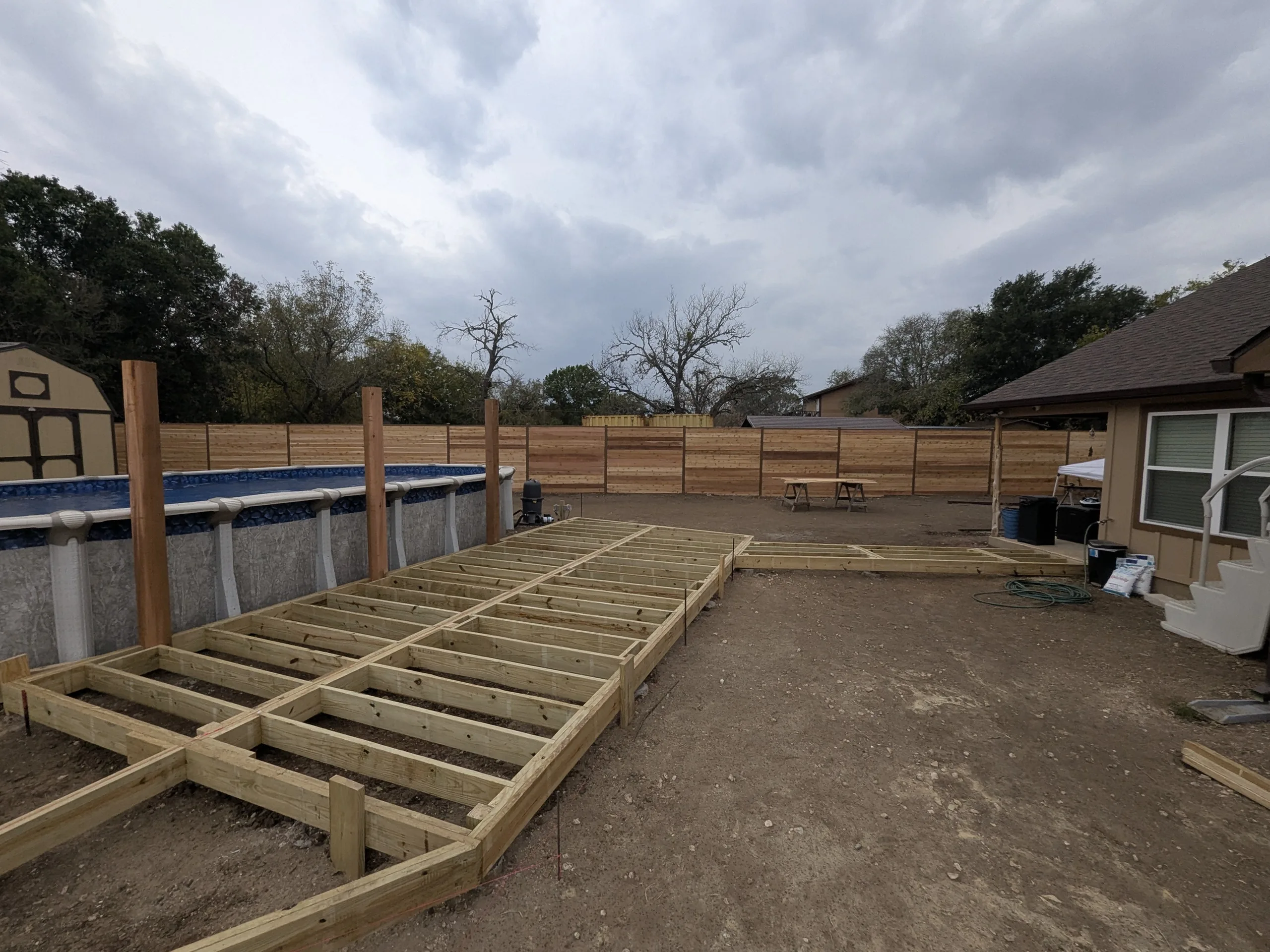Before: Two-tier cedar pool deck and outdoor living space