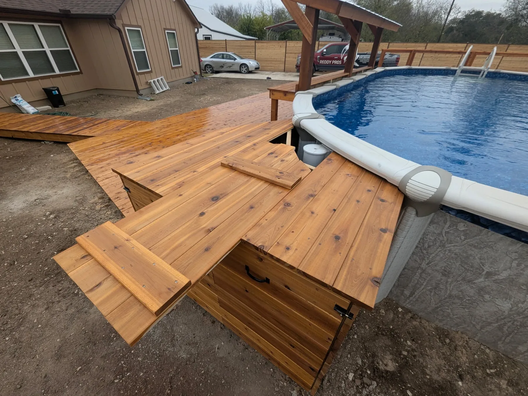 Cedar pool equipment cover opened from the top for service access