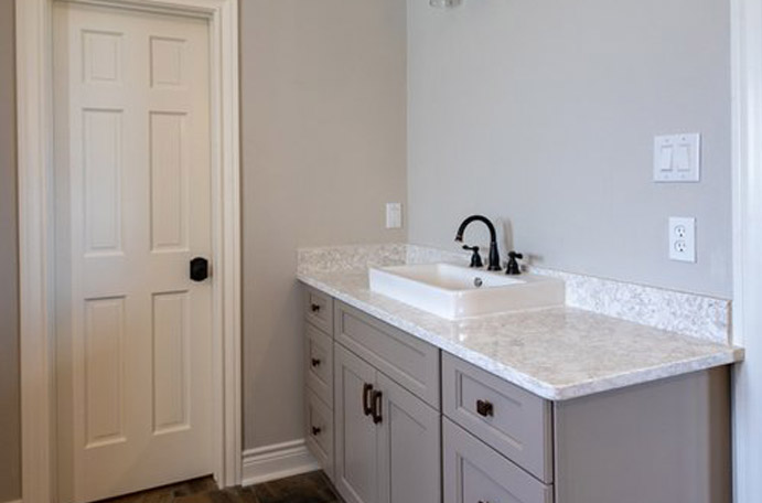 Grey and white themed bathroom remodel in Bandera.