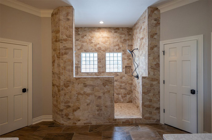 Large two-person tile shower construction.