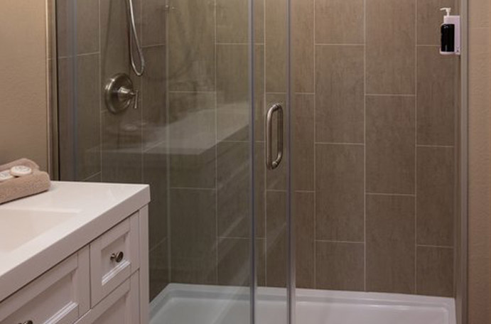 Frameless glass tile shower door in Helotes.